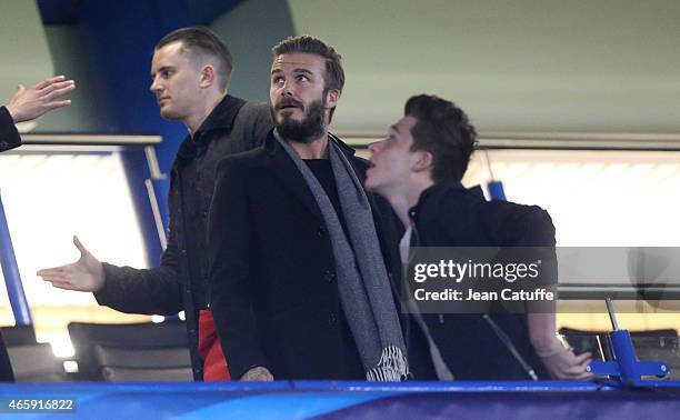 David Beckham and his son Brooklyn Beckham attend the UEFA Champions League match between Chelsea FC and Paris Saint-Germain FC at Stamford Bridge...