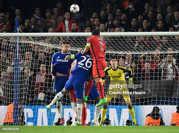 Thiago Silva of PSG rises above John Terry of Chelsea to score a goal to level the scores at 2-2 during the UEFA Champions League Round of 16, second...