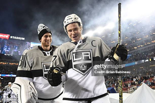 Back-up goaltender Martin Jones and Dustin Brown of the Los Angeles Kings smile as they walk back to the locker room after the 2015 Coors Light NHL...