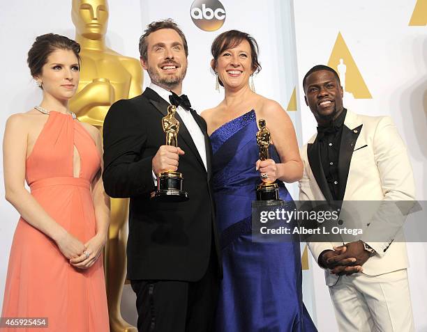 Actress Anna Kendrick, Patrick Osborne, Kristina Reed winners of the Best Animated Short Film Award for 'Feast' and actor Kevin Hart pose inside the...