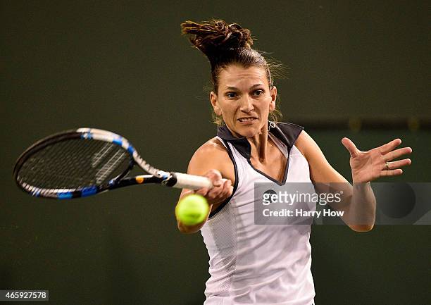 Chanelle Scheepers of South Africa hits a forehand in her match against Sloane Stephens during the BNP Parisbas Open at the Indian Wells Tennis...