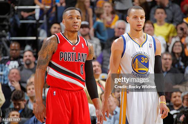 Damian Lillard of the Portland Trail Blazers faces off against Stephen Curry of the Golden State Warriors on January 26, 2014 at Oracle Arena in...