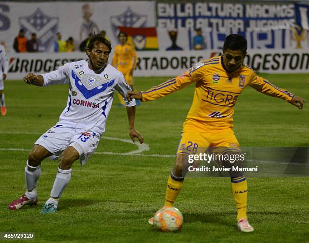 Wilder Zabala of San Jose fights for teh ball with Dieter Villalpando of Tigres during a match between San Jose Oruro and Tigres UANL as part of Copa...