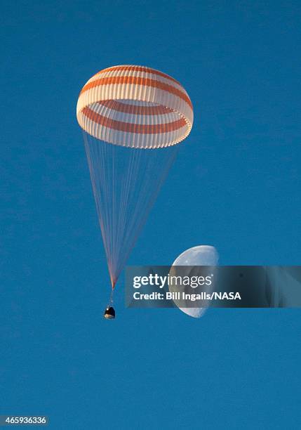 In this handout provided by the U.S. National Aeronautics and Space Administration , the Soyuz TMA-14M spacecraft is seen as it lands with Expedition...