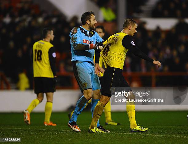 Manuel Almunia of Watford argues with Lars Joel Ekstrand during the Sky Bet Championship match between Nottingham Forest and Watford at City Ground...