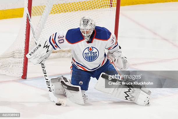 Ben Scrivens of the Edmonton Oilers makes a save against the Minnesota Wild during the game on January 16, 2014 at the Xcel Energy Center in St....