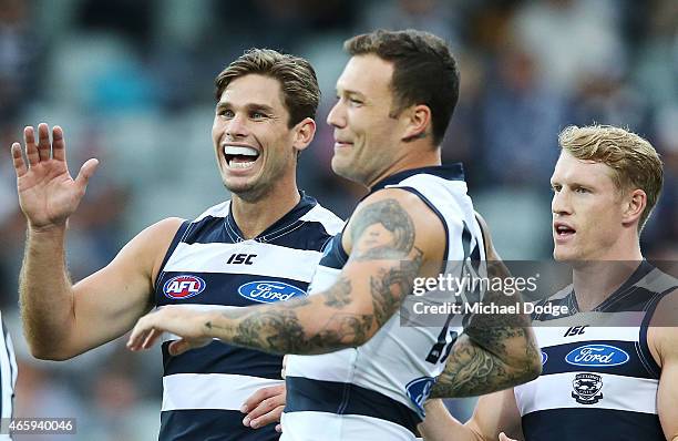 Tom Hawkins Mitch Clark and Josh Caddy of the Cats the Cats celebrates a goal during the NAB Challenge AFL match between the Geelong Cats and the...