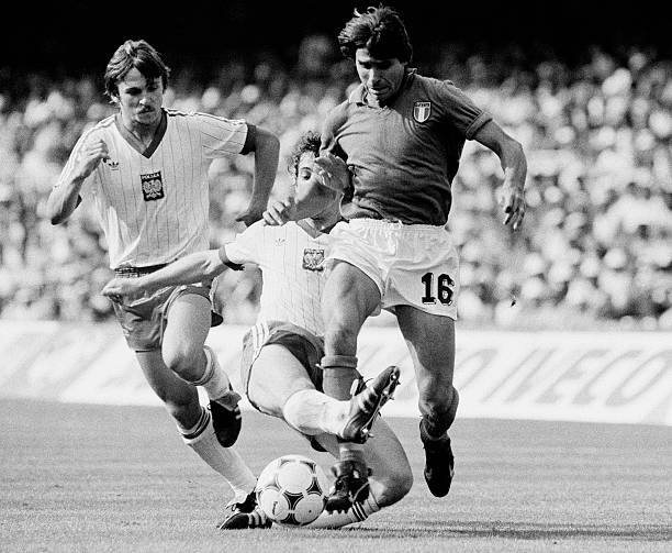 Bruno Conti of Italy is tackled during the FIFA World Cup Semi-Final between Italy and Poland at the Nou Camp in Barcelona on 5th July 1982. Italy...