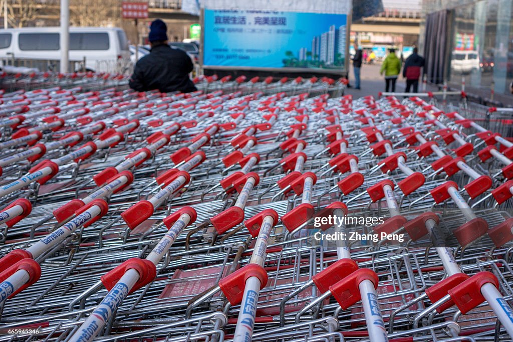 Shopping carts ouside a Carrefour supermarket.   Carrefour...