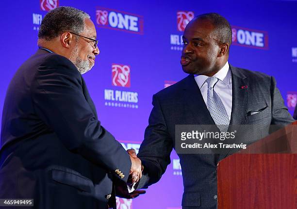 DeMaurice Smith, Executive Director of the National Football League Players Association, greets Lonnie Bunch, Director of the National Museum of...