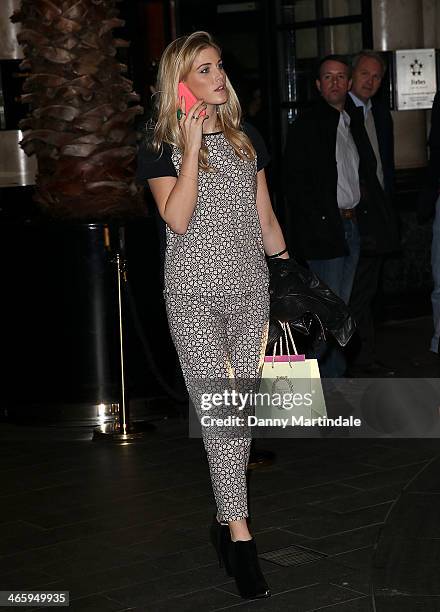 Ashley James on her phone at 'Kate Moss At The Savoy', an exhibition of never before seen photographies of Kate Moss, at The Savoy Hotel on January...