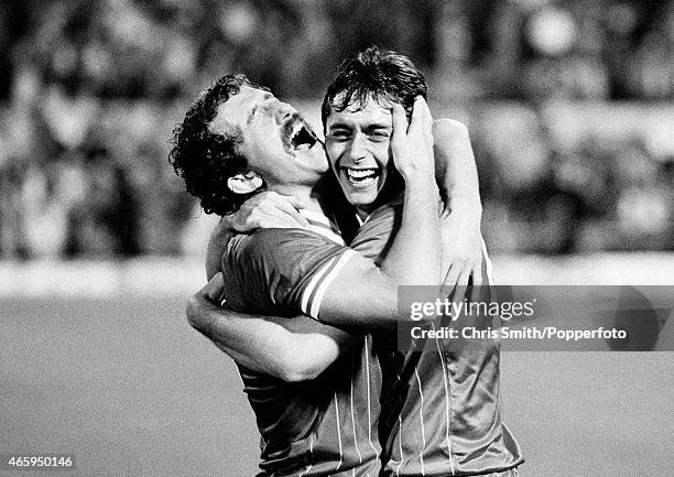 Graeme Souness, captain of Liverpool , celebrates with his teammate Michael Robinson after victory over Roma in the European Cup Final between...