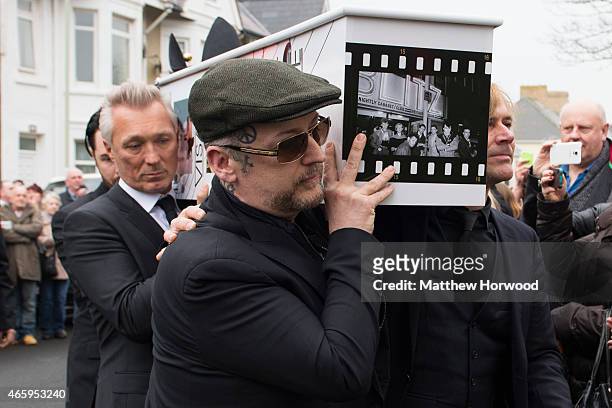 Martin Kemp and Boy George carry the coffin of Visage star Steve Strange during his funeral at All Saints Church on March 12, 2015 in Porthcawl,...