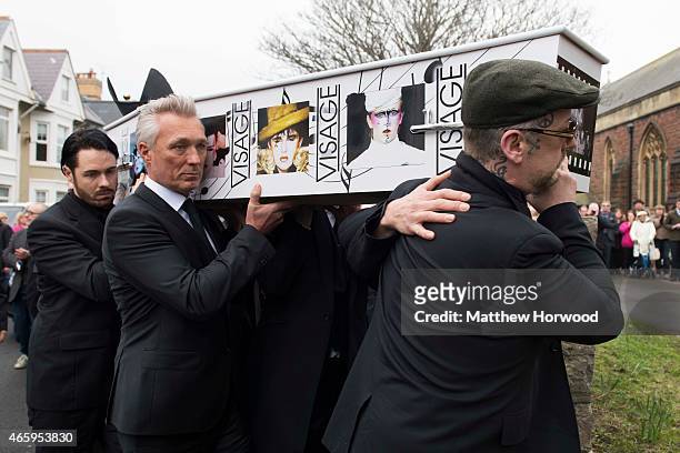 Martin Kemp and Boy George carry the coffin of Visage star Steve Strange during his funeral at All Saints Church on March 12, 2015 in Porthcawl,...