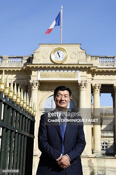 Lobsang Sangay, Sikyong of the Tibetan Government-in-Exile, poses in front of the French National Assembly on March 12, 2015 in Paris. AFP PHOTO /...
