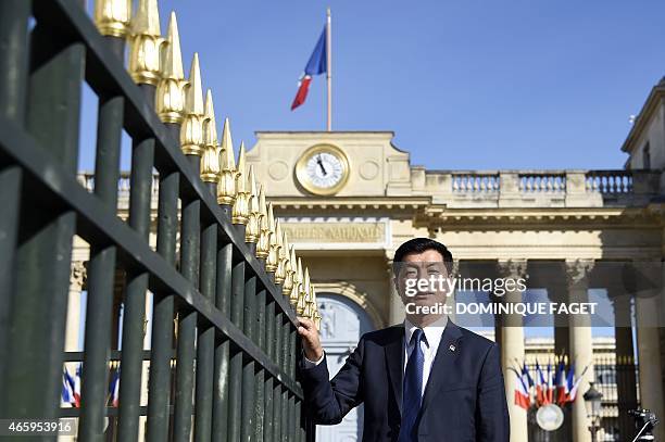 Lobsang Sangay, Sikyong of the Tibetan Government-in-Exile, poses in front of the French National Assembly on March 12, 2015 in Paris. AFP PHOTO /...