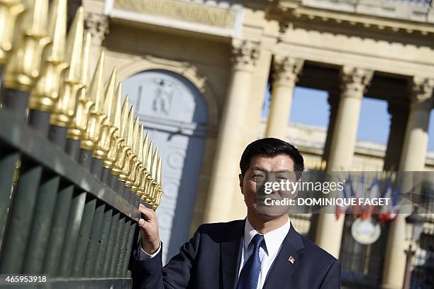 Lobsang Sangay, Sikyong of the Tibetan Government-in-Exile, poses in front of the French National Assembly on March 12, 2015 in Paris. AFP PHOTO /...