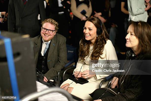 Catherine, Duchess of Cambridge watches live filming of a scene during an official visit to the set of Downton Abbey at Ealing Studios on March 12,...