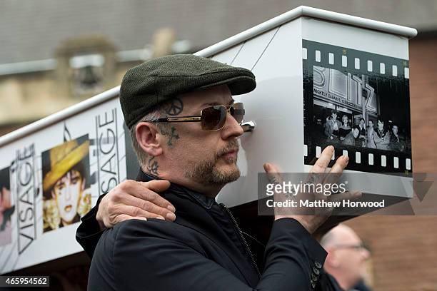 Boy George carries the coffin of Visage star Steve Strange out of All Saints Church on March 12, 2015 in Porthcawl, Wales. Steve Strange was the lead...