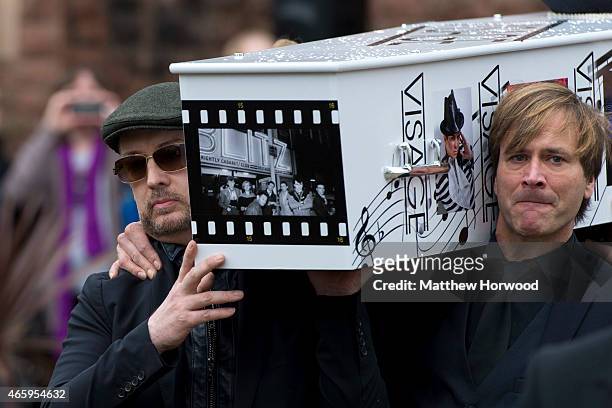 Boy George and Steve Norman carry the coffin of Visage star Steve Strange during his funeral at All Saints Church on March 12, 2015 in Porthcawl,...