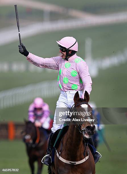 Ruby Walsh on Vautour celebrates after winning the JLT Novices' Chase during St Patrick's Thursday at the Cheltenham Festival at Cheltenham...