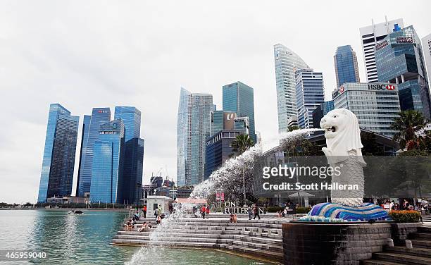 View of the Merlion and the Singapore financial district near the Singapore River on March 9, 2015 in Singapore.
