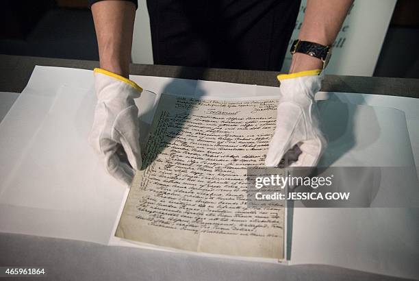 Senior Curator at the Nobel Museum, Margrit Wettstein presents the testament of Swedish scientist Alfred Nobel during a press meeting on March 12,...