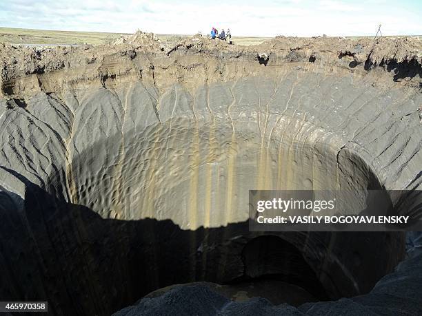 General view taken on August 25, 2014 shows a crater on the Yamal Peninsula, northern Siberia. Russian scientists have now discovered seven giant...