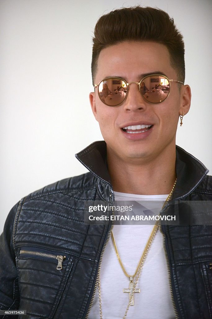 Artist Singer Ricon Colombian reggaeton performer Reykon gestures during an interview ...
