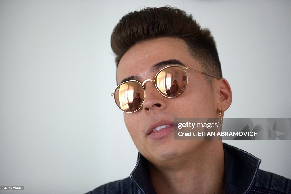 Artist Singer Ricon Colombian reggaeton performer Reykon gestures during an interview ...