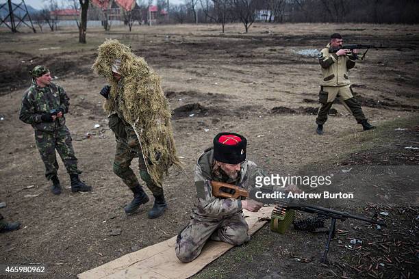 Ethnically Cossack pro-Russian rebels practice their firearms skills at a firing range on March 12, 2015 in Donetsk, Ukraine. The conflict between...
