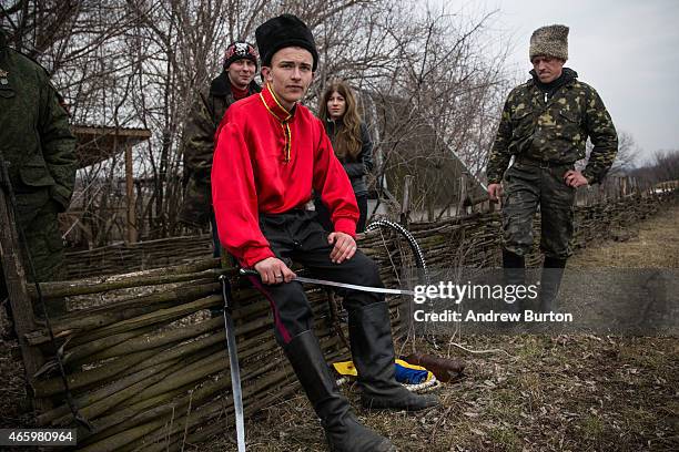 Ethnically Cossack pro-Russian rebels take a break after a skills performance on March 12, 2015 in Makeevka, Ukraine. The conflict between Ukraine...