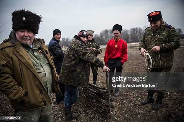 Ethnically Cossack pro-Russian rebels take a break after a skills performance on March 12, 2015 in Makeevka, Ukraine. The conflict between Ukraine...
