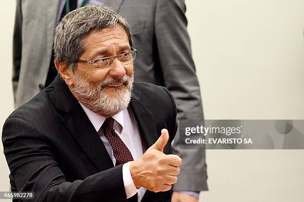 Petrobras former President Jose Sergio Gabrielli gives the thumbs up during a hearing with the Parliamentary Commission of Inquiry that investigates...