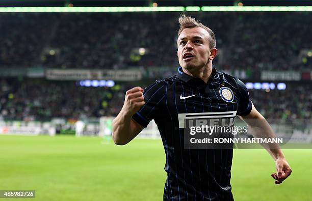 Inter Milan's Swiss midfielder Xherdan Shaqiri celebrates during the UEFA Europa League first-leg, Round of 16 football match VfL Wolfsburg vs FC...