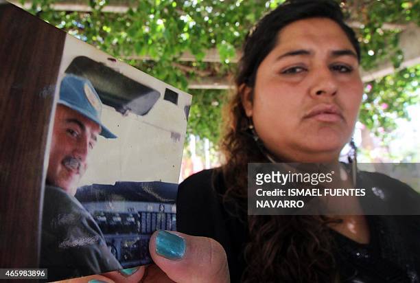 Azucena Aguero, widow of Juan Carlos Castillo, pilot of one of the two helicopters that crashed mid-air near Villa Castelli on Monday whilst filming...
