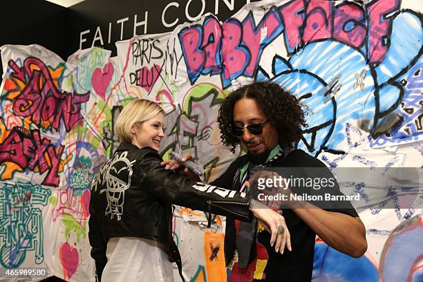 Actress Kelly Rutherford and Le H attend the "Faith Connexion Street Art Tour" hosted by Saks Fifth Avenue and Marie Claire at Saks Fifth Avenue on...