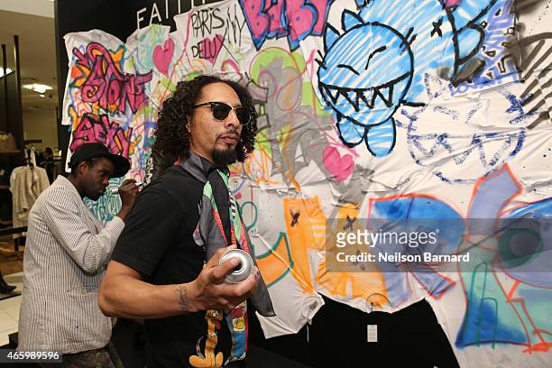 Le H and Reyz attend the "Faith Connexion Street Art Tour" hosted by Saks Fifth Avenue and Marie Claire at Saks Fifth Avenue on March 12, 2015 in New...