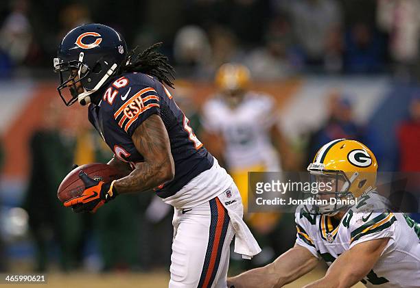 Tim Jennings of the Chicago Bears breaks away from Jordy Nelson of the Green Bay Packers after intercepting a pass at Soldier Field on December 29,...