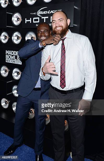 Mixed martial artist Uriah Hall and professional football player Travis Brown attend the Bud Light Madden Bowl at The Bud Light Hotel on January 30,...