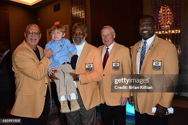 Ingram Dismuke poses with NFL Hall of Fame Inductees Paul Krause, Bobby Bell, Jan Stenerud, and Randall McDaniel during the 2014 Legends For Charity...