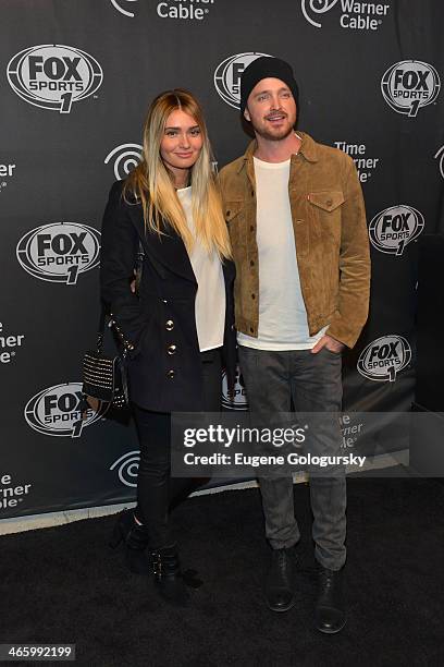 Lauren Parsekian and Aaron Paul attend Time Warner Cable Studios Presents FOX Sports 1 Thursday Night Super Bash on January 30, 2014 in New York City.