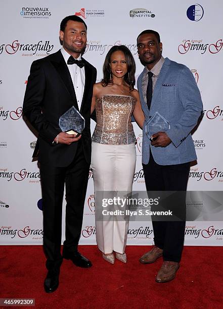 Football player Louis Murphy, chief consultant of Ombi Group Kimberly K. Haynes, and football player Jerricho Cotchery attend the 4th Annual Giving...