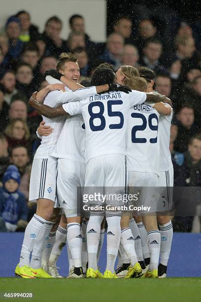 Oleh Husyev of Dynamo Kyiv is congratulated by teammates after scoring the opening goal during the UEFA Europa League Round of 16, first leg match...
