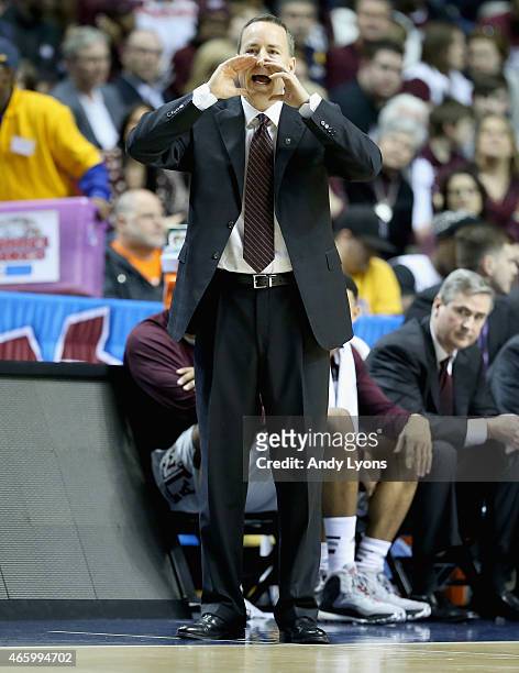 Billy Kennedy the head coach of the Texas A&M Aggies gives instructions to his team against the Auburn Tigers during the second round game of the SEC...