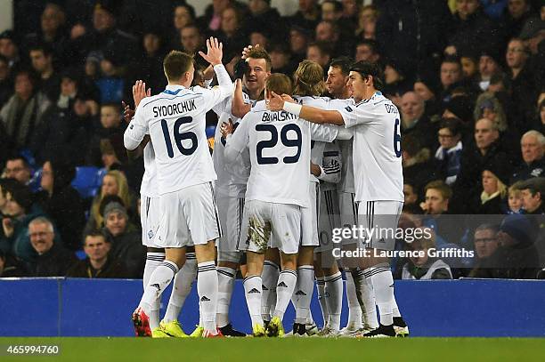 Oleh Husyev of Dynamo Kyiv is congratulated by teammates after scoring the opening goal during the UEFA Europa League Round of 16, first leg match...