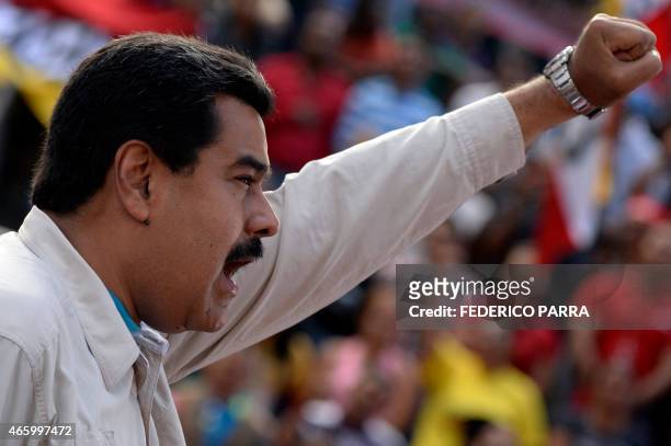 Venezuelan President Nicolas Maduro delivers a speech before supporters gathering outside the presidential palace in Caracas on March 12, 2015. The...