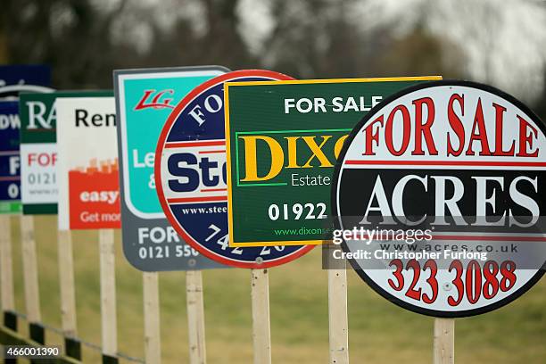 In this photo illustration an array of property For Sale marketing boards are erected at sign manufacturers Real Estate Advertising Ltd on March 11,...
