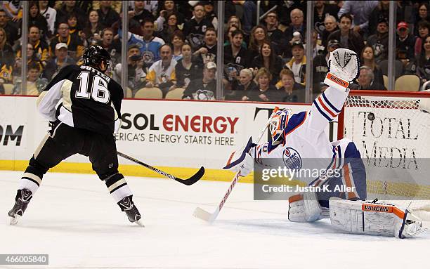 Brandon Sutter of the Pittsburgh Penguins scores past Ben Scrivens of the Edmonton Oilers in the first period during the game at Consol Energy Center...