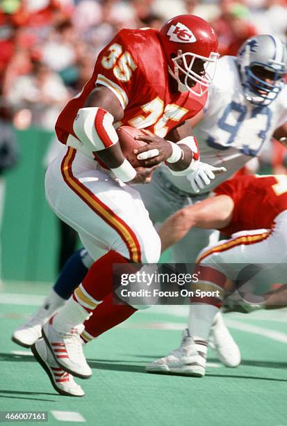 Christian Okoye of the Kansas City Chiefs carries the ball against the Detroit Lions during an NFL football game October 14, 1990 at Arrowhead...